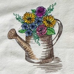 Watering can and spring flowers